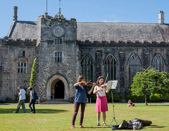 Madeleine Mitchell and one of her students practise outside at Dartington. Photo: Terry Jeavons Photography